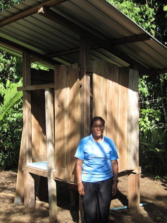 Achuar mother Rosa in front of the completed ecological dry toilet