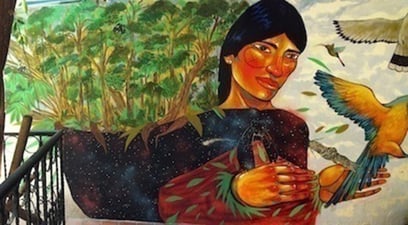Mural painting of an Achuar woman at Fundación Pachamama in Quito, Ecuador