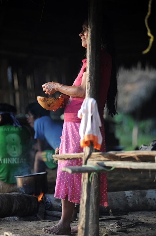 Achuar Woman Preparing Chica