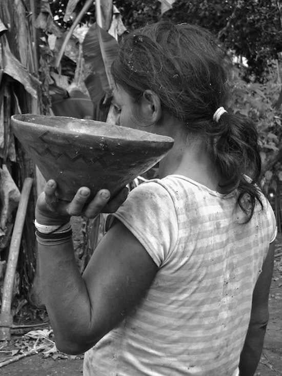 Achuar woman holding chicha