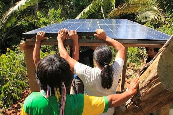 Finishing installation of solar panels at Tiinkias Ecolodge in Ecuador's Amazon
