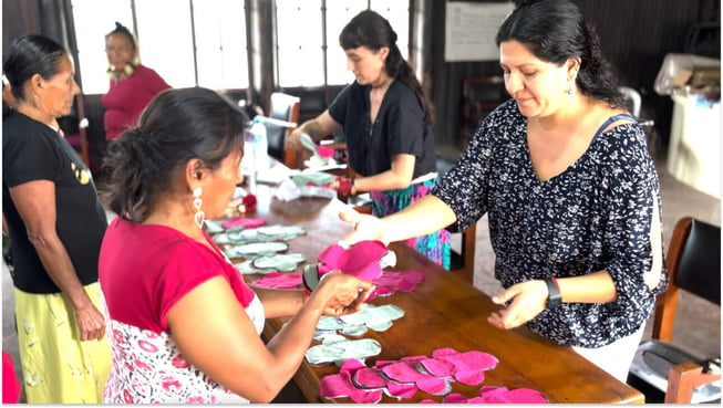 Women handing out birthing kit